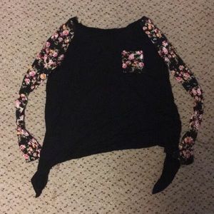 Black shirt with floral sleeves and open back